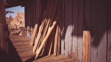 CGI Weathered wooden planks leaning against an old building in a rural setting video
