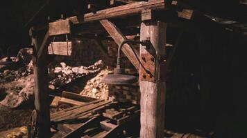CGI Night lit rustic mining structure with tools in the background video