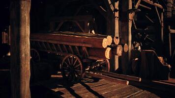 CGI Wooden cart filled with logs inside a rustic warehouse during the day video