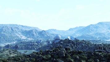 CGI Military base situated in mountainous terrain during clear weather conditions video