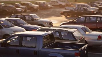 CGI Busy parking lot filled with various parked vehicles during sunset hours video