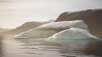 CGI Majestic iceberg floating gently in tranquil waters at dawn in Greenland video
