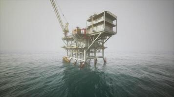 CGI Old oil platform standing in calm waters on a foggy day at sea video
