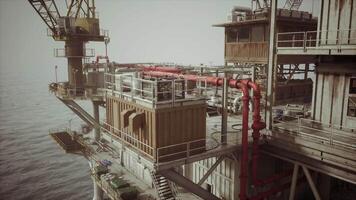 CGI Old oil platform by the calm sea on a clear day with tools video