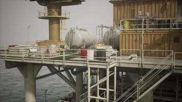 CGI Oil platform in ocean with storage tanks and production equipment visible video