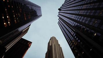 CGI Looking up at skyscrapers in an urban setting during the day video