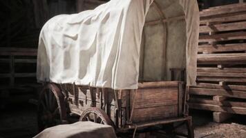 CGI Exploring an old wooden wagon covered with a cloth at a rustic location video