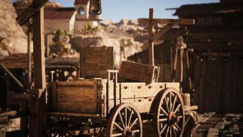 CGI Old wooden cart filled with crates in a rugged western mining town setting video