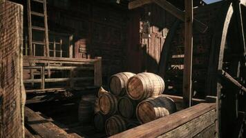 CGI Old wooden barrels stacked in a rustic shed illuminated by sunlight video