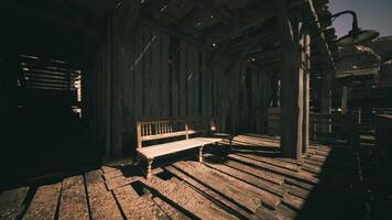 CGI A rustic wooden bench situated in a dimly lit old building at golden hour video