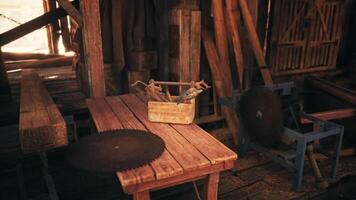 CGI Woodworking tools are organized on a rustic table in a workshop video