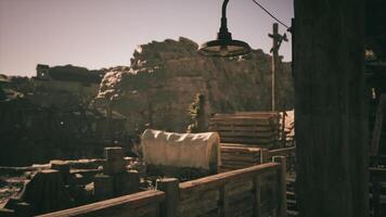 CGI A vintage western town with rustic structures and a dusty landscape at dusk video