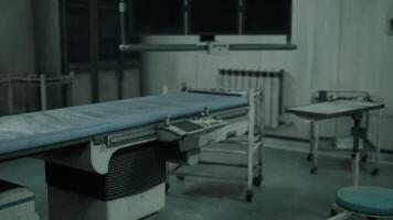 CGI Abandoned hospital room with a disused examination table and eerie atmosphere video