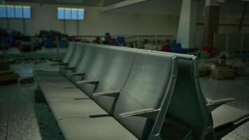 CGI Abandoned airport terminal seating area with empty rows of chairs and debris video