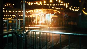 CGI Empty amusement park at night with bright lights and closed attractions video