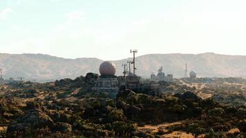 CGI Military base situated in mountainous terrain during daylight hours video