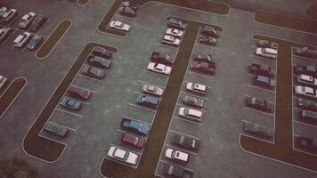 CGI Aerial view of a nearly empty parking lot during daytime with parked cars video