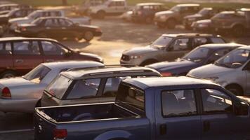 CGI Vehicles parked in a crowded lot during sunset at a busy shopping center video