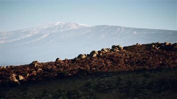 CGI Landscape view of rocky terrain and distant mountains during twilight hours video