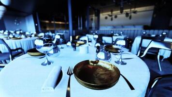 CGI Elegant dining setup in an empty restaurant ready for guests at night video