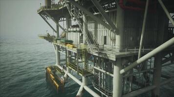 CGI Old oil platform standing in calm waters under a hazy sky at dawn video