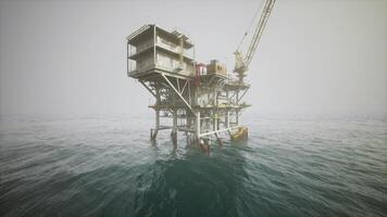 CGI Old oil platform in a hazy sea setting, showcasing offshore extraction activity video