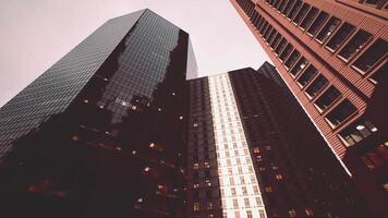 CGI Tall urban buildings reflecting light in a bustling cityscape during dusk video