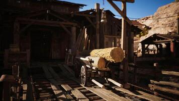 CGI Wooden cart loaded with logs at a rustic western style lumberyard video