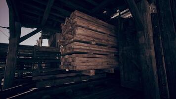 CGI Stacked wooden planks in a rustic storage area during daylight hours video