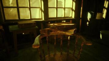 CGI An old wooden chair sits quietly in a sunlit room with large windows video