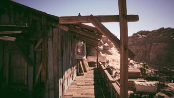 CGI Rustic wooden lantern hangs at a miner shack in the desert landscape video