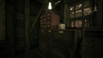 CGI Rustic wooden cabinet and books inside a dimly lit cabin at night video