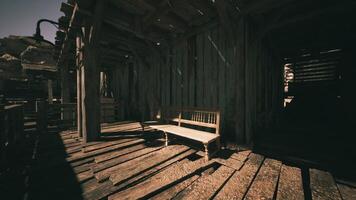 CGI Abandoned wooden bench in a rustic structure surrounded by shadows video