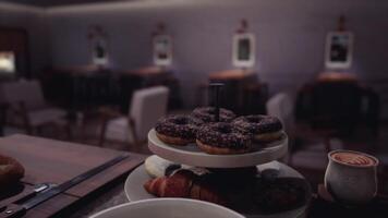 CGI Pastry display with donuts and croissants in a cozy cafe setting video