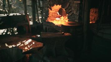 CGI Crafting tools and artwork in an old forge with glowing coals video
