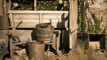 CGI Rustic wooden buckets resting on a weathered porch surrounded by greenery video