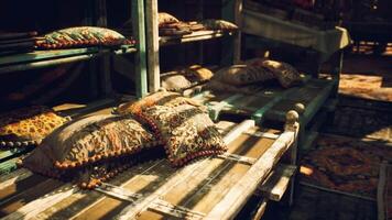 CGI Decorative cushions placed on rustic wooden shelves in a market setting video