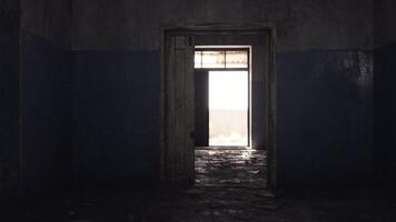 CGI Light streaming through an open door in an abandoned building video