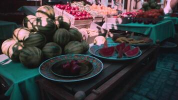 CGI Fresh fruits displayed at a bustling market in midday sunlight video