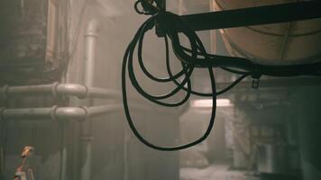 CGI Industrial setting with tangled cables and dim lighting in a workshop area video