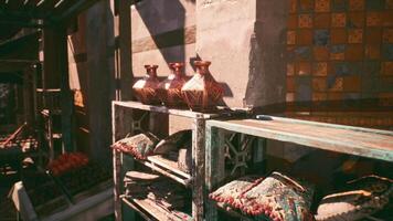 CGI Decorative pottery and textiles displayed in a vibrant marketplace setting video