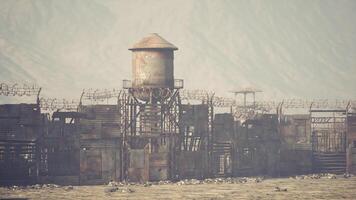 CGI Scrapyard fortress with watchtower in a desolate landscape during daylight video