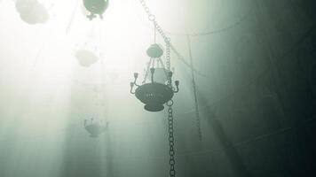 CGI Mysterious chandeliers hanging in a foggy, dimly lit interior space video