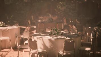 CGI Elegant wedding reception setup in a garden during golden hour video