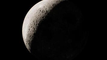 CGI Crescent moon with visible craters against a dark sky at night video