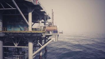 CGI Oil rig platform standing tall over calm ocean waters during daylight hours video