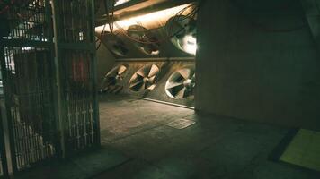 CGI Large industrial fans operating in a dimly lit corridor of a factory video