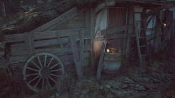CGI Rustic wooden cart and lanterns in a dimly lit outdoor setting video