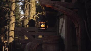 CGI Lantern illuminating rustic wooden cabin in forest during twilight hours video