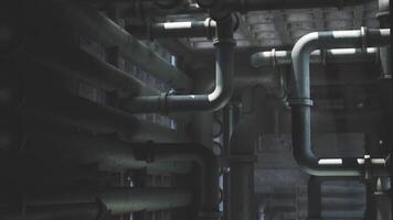 CGI Industrial plumbing pipes create an intricate web in a dark environment video
